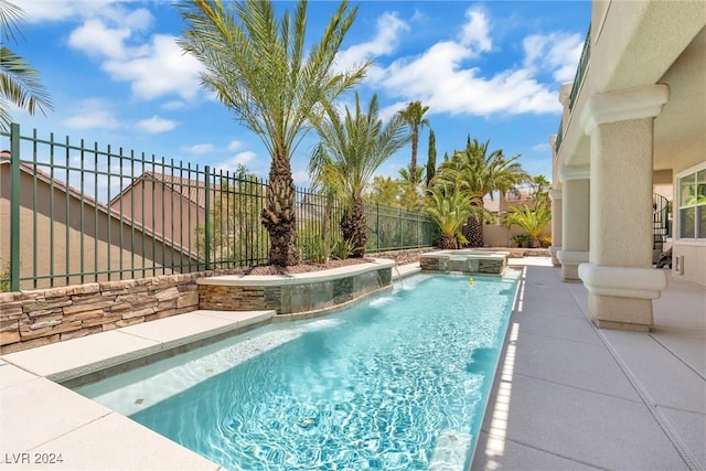 view of swimming pool with an in ground hot tub and pool water feature