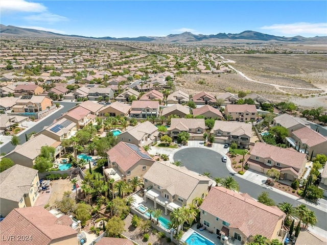 birds eye view of property featuring a mountain view