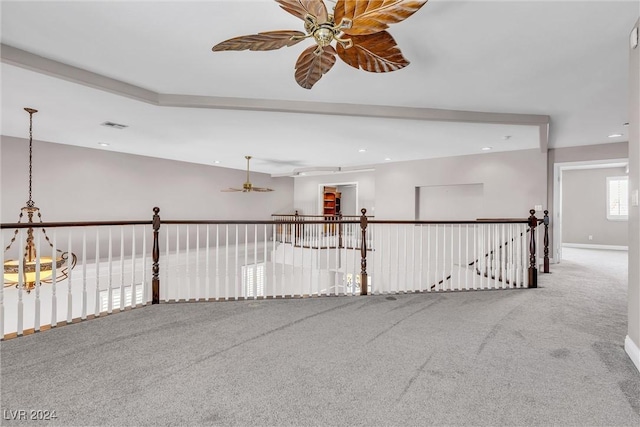 carpeted empty room featuring ceiling fan