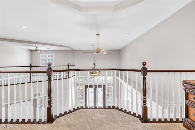 staircase with carpet and ceiling fan