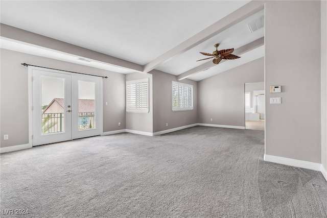 spare room featuring vaulted ceiling with beams, ceiling fan, french doors, and light carpet