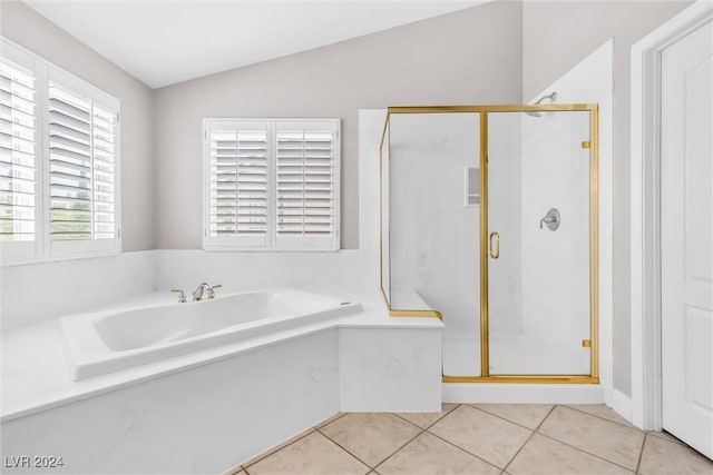 bathroom featuring tile patterned floors, plus walk in shower, and vaulted ceiling