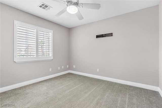 empty room with carpet and ceiling fan