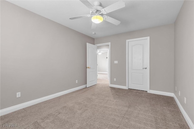 unfurnished bedroom with light carpet and ceiling fan