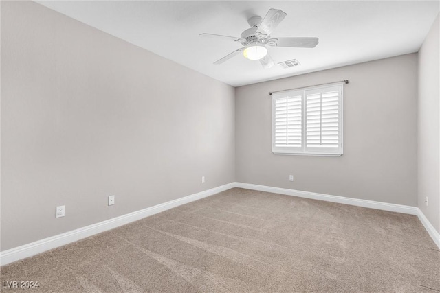 carpeted empty room with ceiling fan