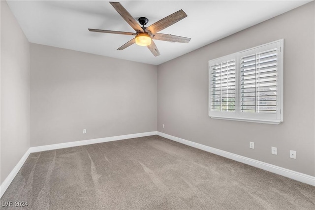 spare room featuring carpet flooring and ceiling fan