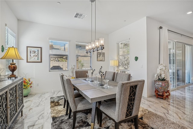 dining area with a chandelier