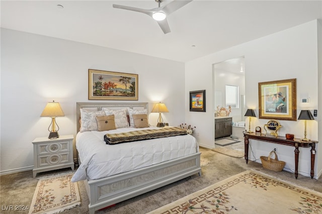 bedroom with light carpet, ceiling fan, and ensuite bathroom