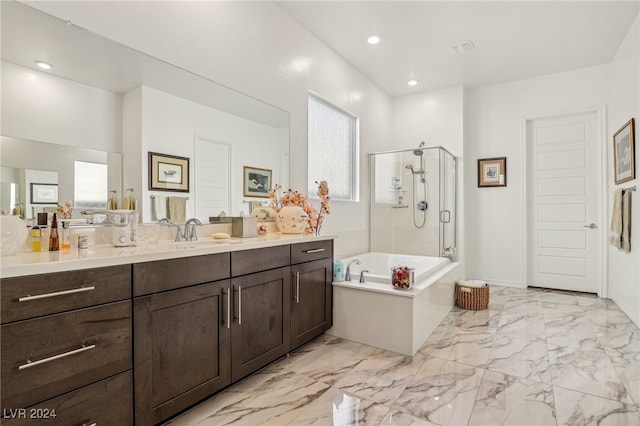 bathroom with shower with separate bathtub and vanity