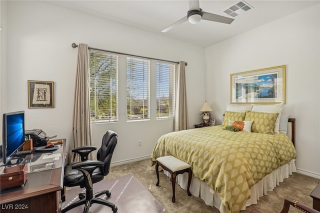 bedroom with ceiling fan and light colored carpet