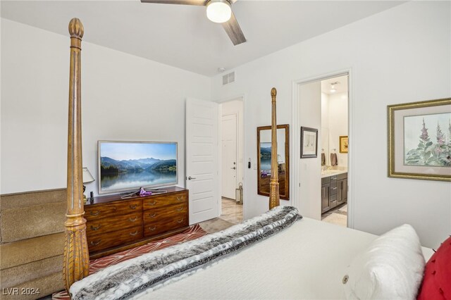 bedroom with ensuite bath and ceiling fan