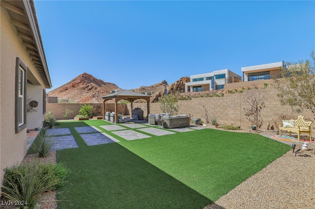 view of yard with a mountain view, an outdoor hangout area, a gazebo, and a patio area