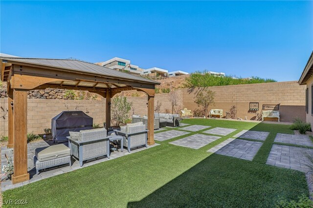 view of yard featuring an outdoor hangout area, a gazebo, and a patio