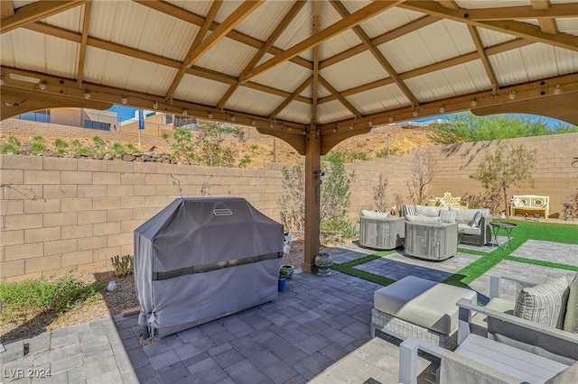 view of patio with grilling area, outdoor lounge area, and a gazebo