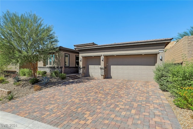 view of front of property featuring a garage