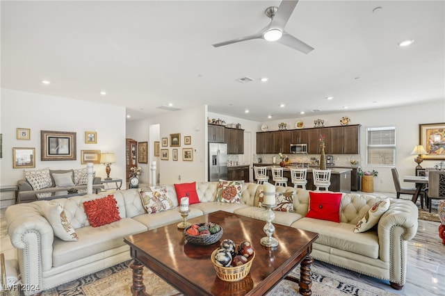 living room featuring ceiling fan