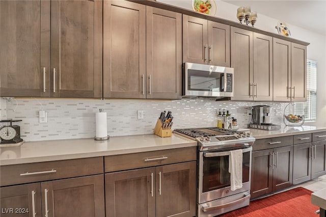 kitchen featuring decorative backsplash and appliances with stainless steel finishes