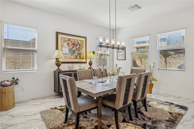 dining room with a notable chandelier and a wealth of natural light