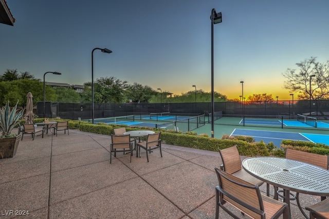 patio terrace at dusk with tennis court