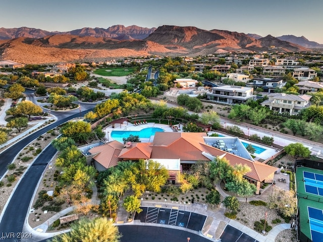 birds eye view of property with a mountain view