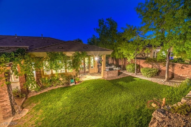 view of yard featuring exterior kitchen and a patio