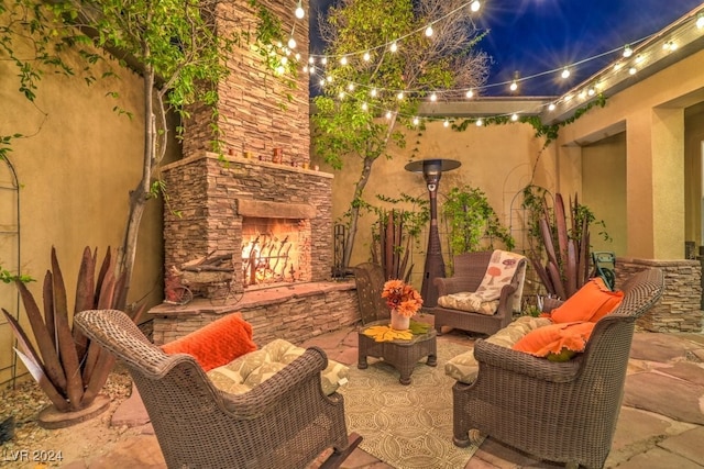 view of patio with an outdoor stone fireplace