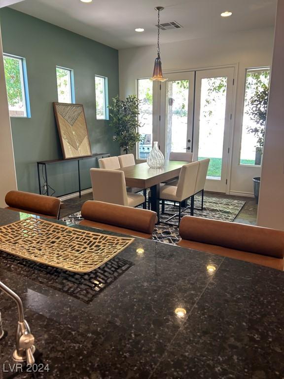 dining room featuring a wealth of natural light and french doors