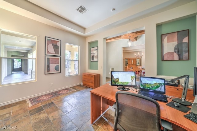 office area with an inviting chandelier