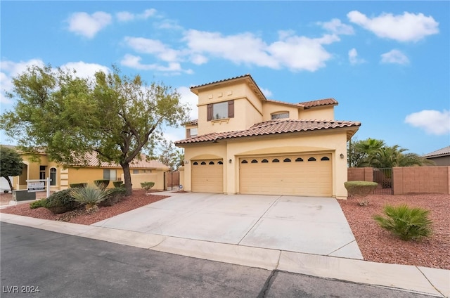 mediterranean / spanish house featuring a garage