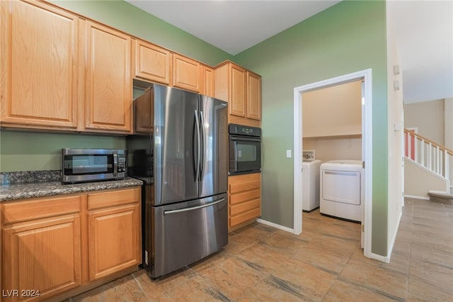 kitchen featuring washing machine and clothes dryer and stainless steel appliances