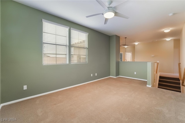 empty room with carpet and ceiling fan