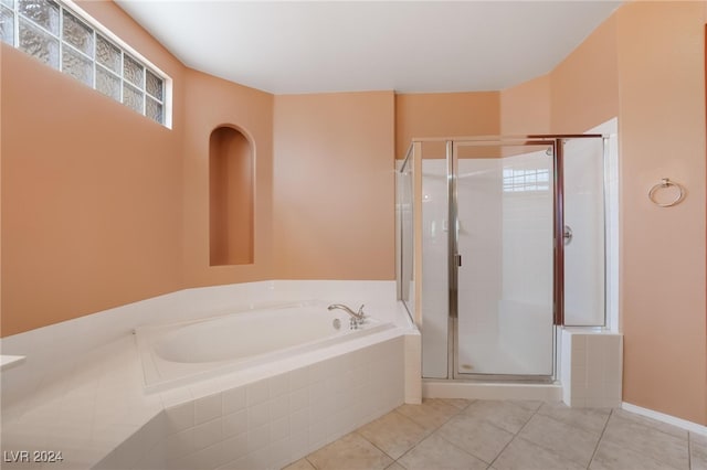 bathroom featuring separate shower and tub and tile patterned floors