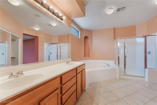 bathroom with tile patterned floors, vanity, and plus walk in shower