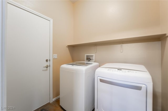 clothes washing area featuring independent washer and dryer