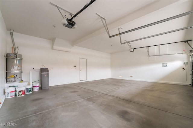 garage with secured water heater and a garage door opener