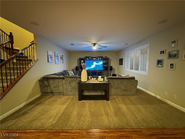 living room with carpet flooring and ceiling fan