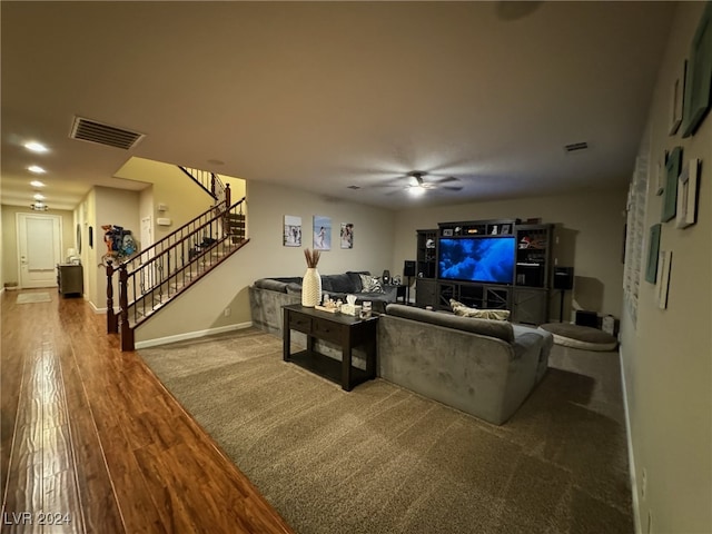 living room featuring ceiling fan and hardwood / wood-style flooring