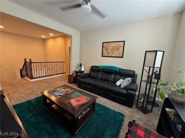 living room featuring carpet and ceiling fan