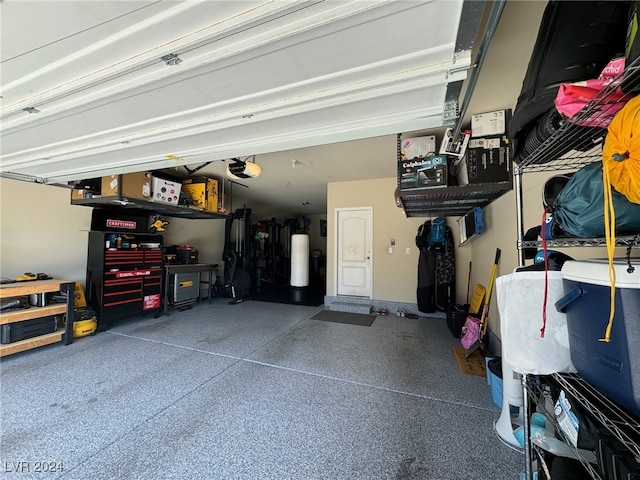 garage featuring a garage door opener and electric water heater