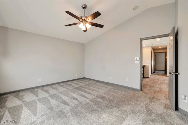 unfurnished bedroom featuring ceiling fan, light colored carpet, and lofted ceiling