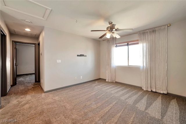 carpeted empty room with ceiling fan