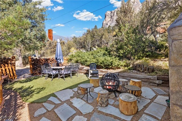 view of patio with a fire pit