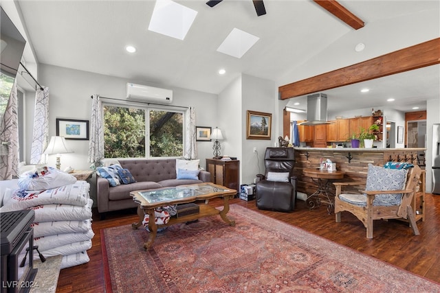 living room with ceiling fan, vaulted ceiling with skylight, a wall mounted air conditioner, and hardwood / wood-style flooring