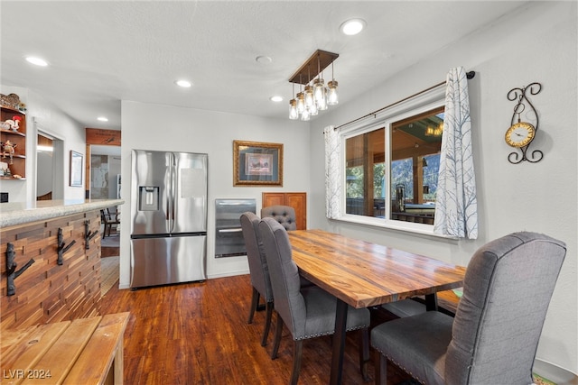 dining space featuring dark hardwood / wood-style flooring