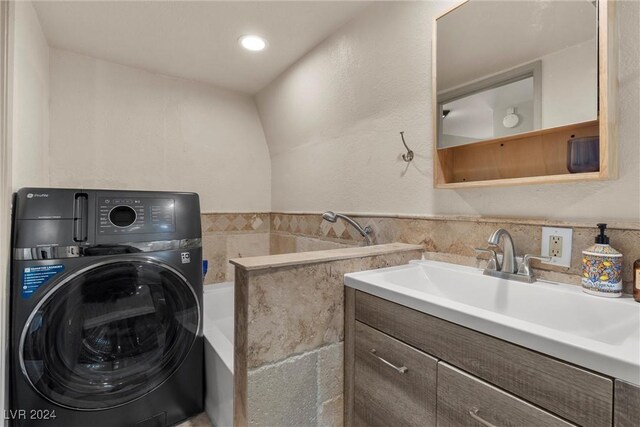 washroom featuring washer / clothes dryer and sink