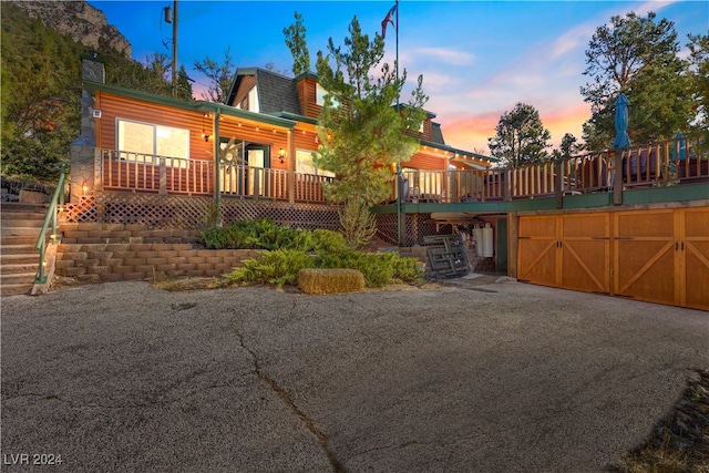 view of front of property featuring a wooden deck