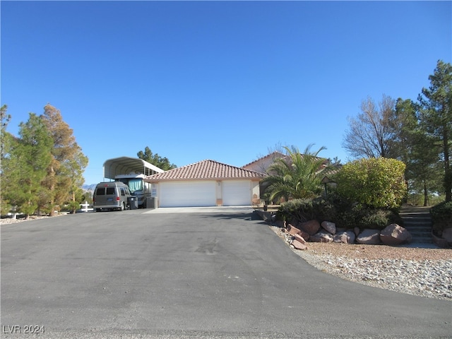 view of front of property featuring a garage