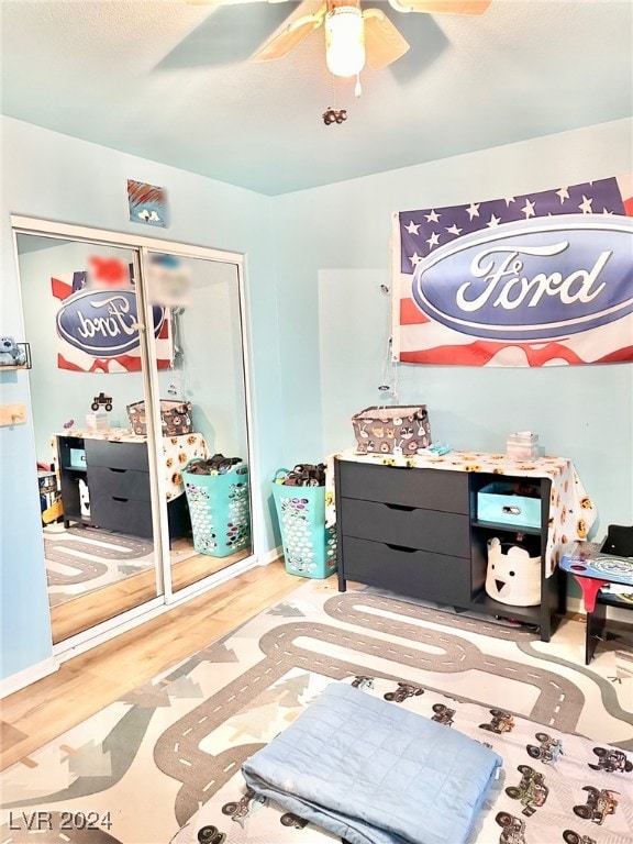 game room with ceiling fan and light hardwood / wood-style flooring