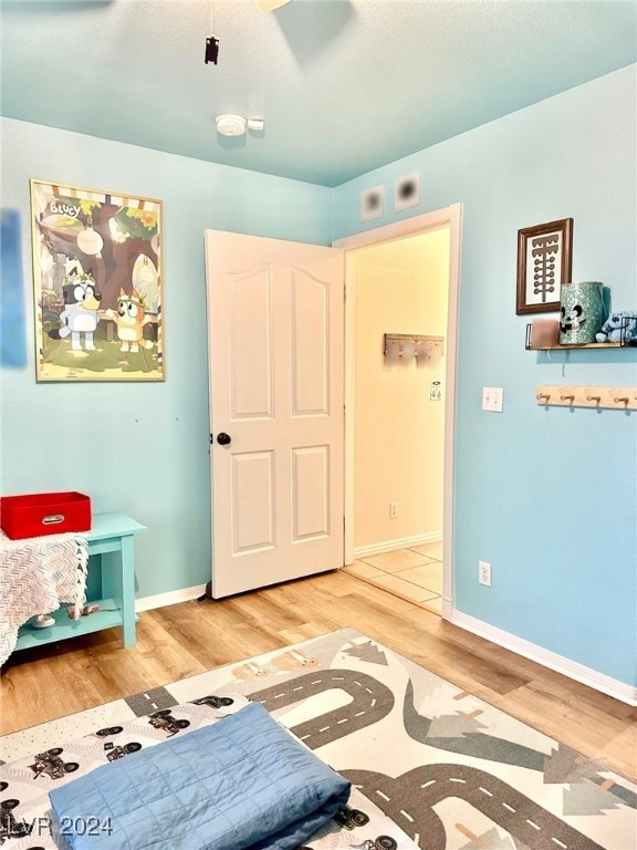 interior space with ceiling fan and hardwood / wood-style floors