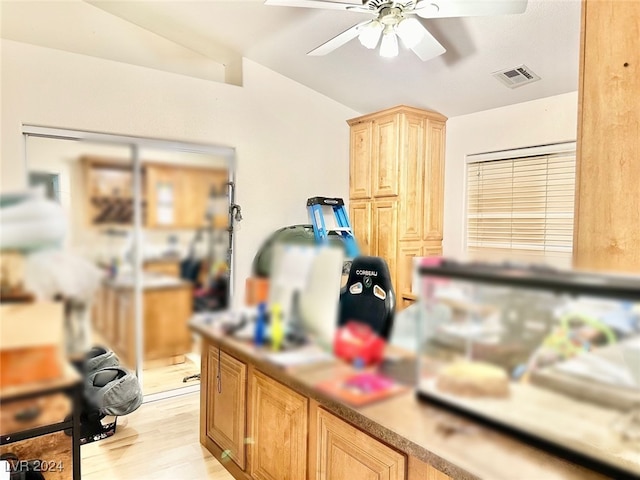 kitchen with light wood-type flooring and ceiling fan